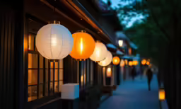 lanterns are hung from the outside of this shop