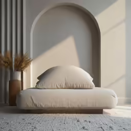 three large pillows are sitting on a white bed