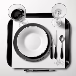 a place setting set for one to enjoy in black and white