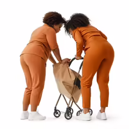 two woman pushing an empty stroller