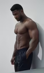 an african man posing in his underwear for the camera