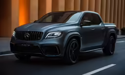 a black mercedes benz pickup truck is driving on the road