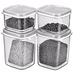four storage containers with lids and various foods