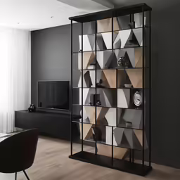 a living room with an unusual shelving unit in the center