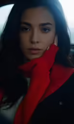 a young woman in red sitting down
