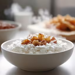 white bowl with food sitting on top of it