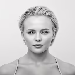 the young woman with blond hair is posing