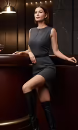 a woman sitting in a bar wearing boots