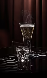 a cup filled with liquid on top of a glass table