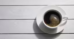 top view of a coffee cup on a wooden table
