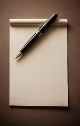 a pen laying on top of a piece of paper