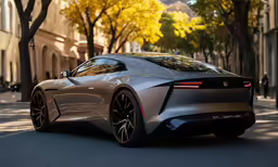 a silver car sitting on the street near buildings
