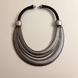 two black leather necklaces with silver accents