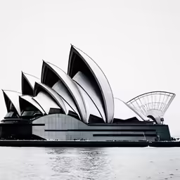 a black and white photo of the opera in sydney