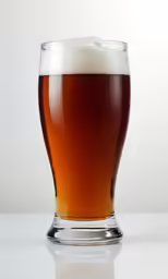 a glass with some liquid inside of it