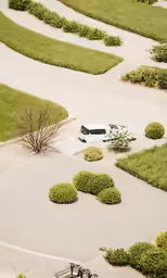 aerial shot of park benches and manicured grass