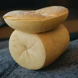 a sandwich on top of each other near a fork