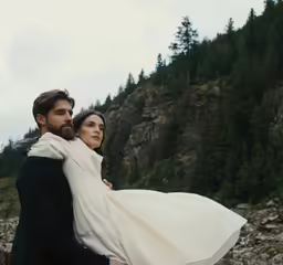 a bride carries her groom on his back