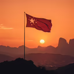 an image of the flag flying at sunset