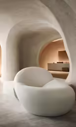 a large white couch sitting in the middle of a room