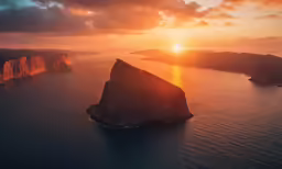 the sun is just peeking down on a rocky hill