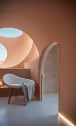 a bathroom with a circular window and some sinks