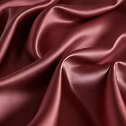 a maroon satin, like satin, textured with thin lines