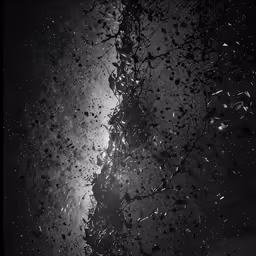 rain is falling down on a street lamp