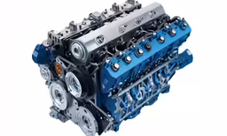 a very large engine with multiple wheels inside