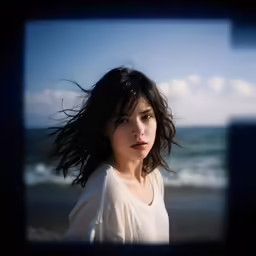 a photo of a woman on the beach