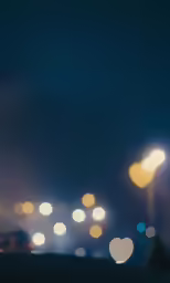 the road is filled with lights and blurs
