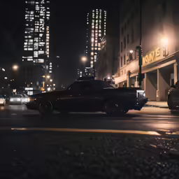 a black car driving past a building next to traffic lights