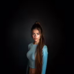 a female model with long hair and a bare breast,a female standing in a dark room with her hair up