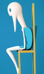 a small white figure sitting in a chair