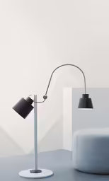 the large lamp stands next to a chair