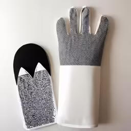 a glove and oven mitt sitting next to each other