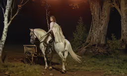 a woman with long hair riding on a horse