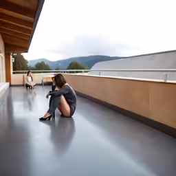 woman in tight heels sitting on the floor of an apartment building