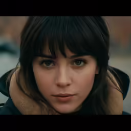 a girl with dark hair is wearing a jacket and coat