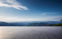 a tiled floor in the middle of a mountain landscape