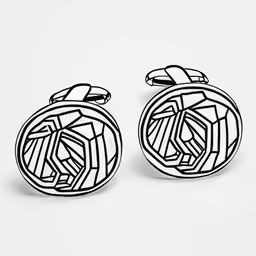 two cuff clips that are on a white surface