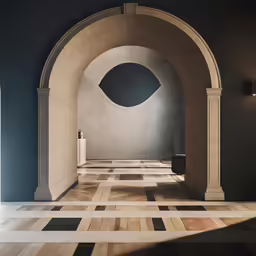 an empty room with a stone archway