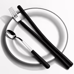 the two silverware is on top of the white plate