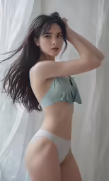 a young woman in a white and blue bathing suit