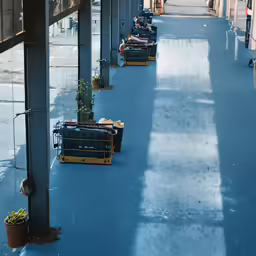 a row of luggage parked on the floor