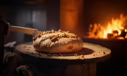a bread sitting on a table with a spatula