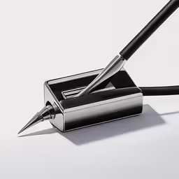 a fountain and a pen on a white table