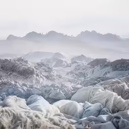 the ground and rocks in front of mountains