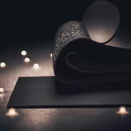 a pair of black shoes sitting on top of a table
