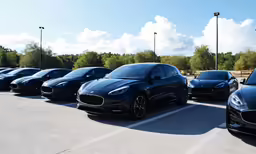 all five jaguar models are lined up in the parking lot